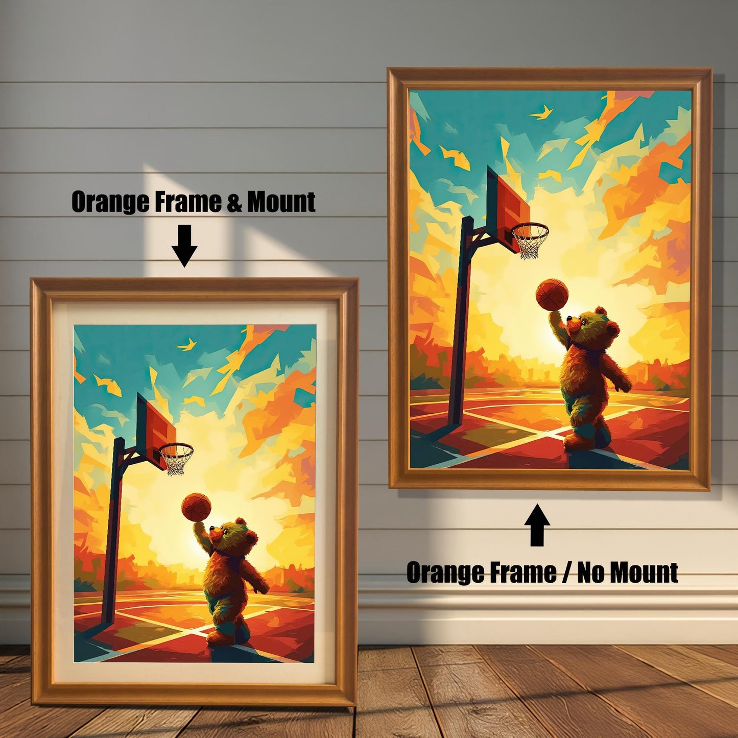 Two versions of a cute teddy bear playing basketball art print with an orange wood frame. The print on the left is a smaller size framed with a white mount (or mat), and the one on the right is a larger size without a mount. The image shows the framed prints against a white paneled wall.