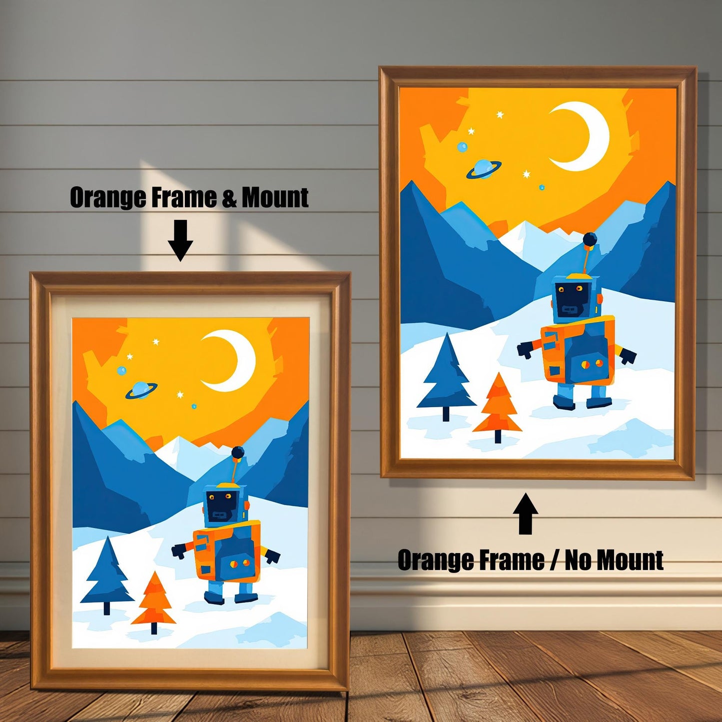 A comparison of two orange-framed wall art prints featuring a robot in a snowy landscape. The print on the left is framed with a white mat, while the one on the right is framed without a mat. The image is shown on a light wood wall.