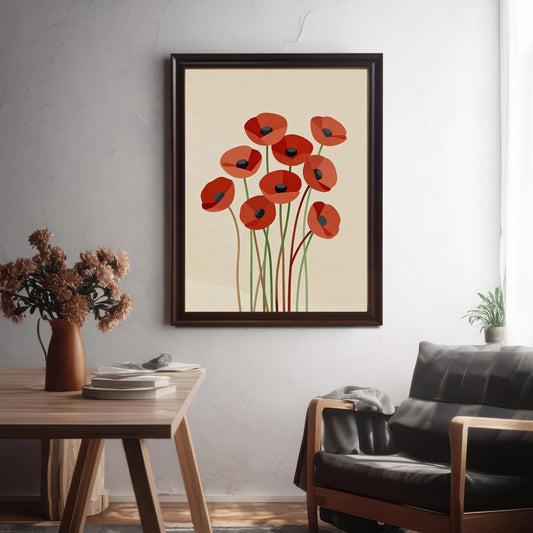 An abstract poppy print in a dark brown frame hangs on a white textured wall in a room with a wooden table and a leather chair.