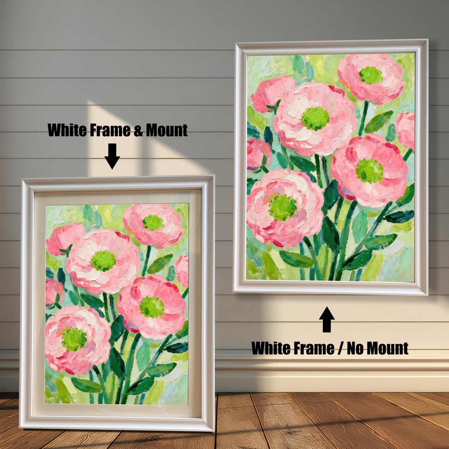A painting of pink flowers in a white frame, shown with and without a white mat, displayed against a rustic wood-paneled wall.