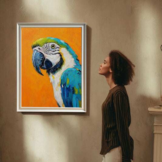 A woman with curly hair looks up at a framed painting of a macaw hanging on a textured wall. The frame is white.
