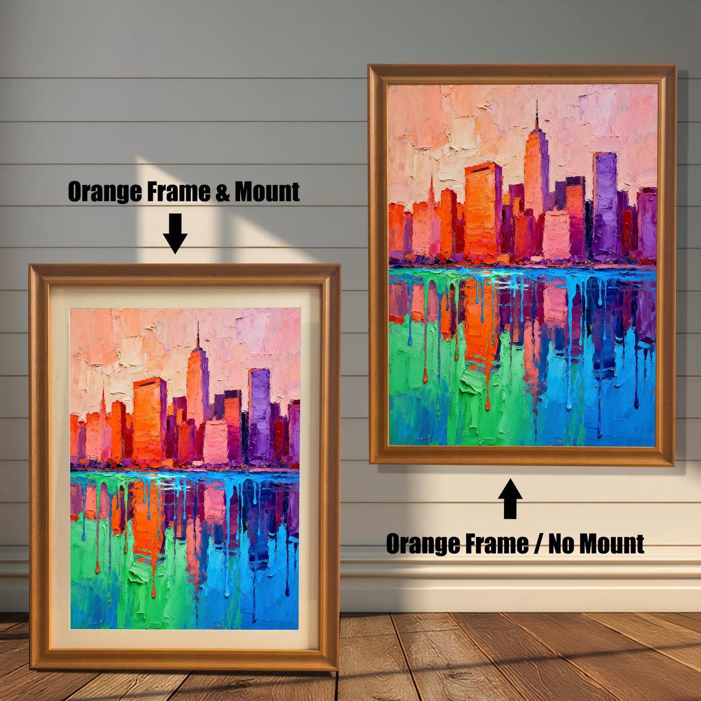 Two framed versions of the vibrant skyline painting. The left shows an "Orange Frame & Mount" (with matting); the right shows an "Orange Frame / No Mount" (no matting).