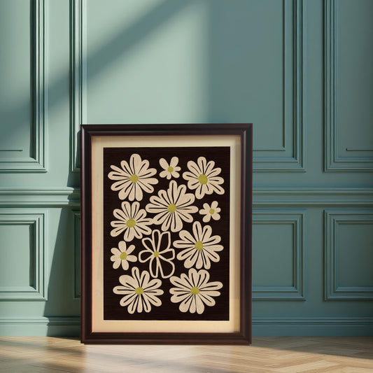 Coffee framed art print of retro daisy flowers, leaning on the floor against a mint green paneled wall.