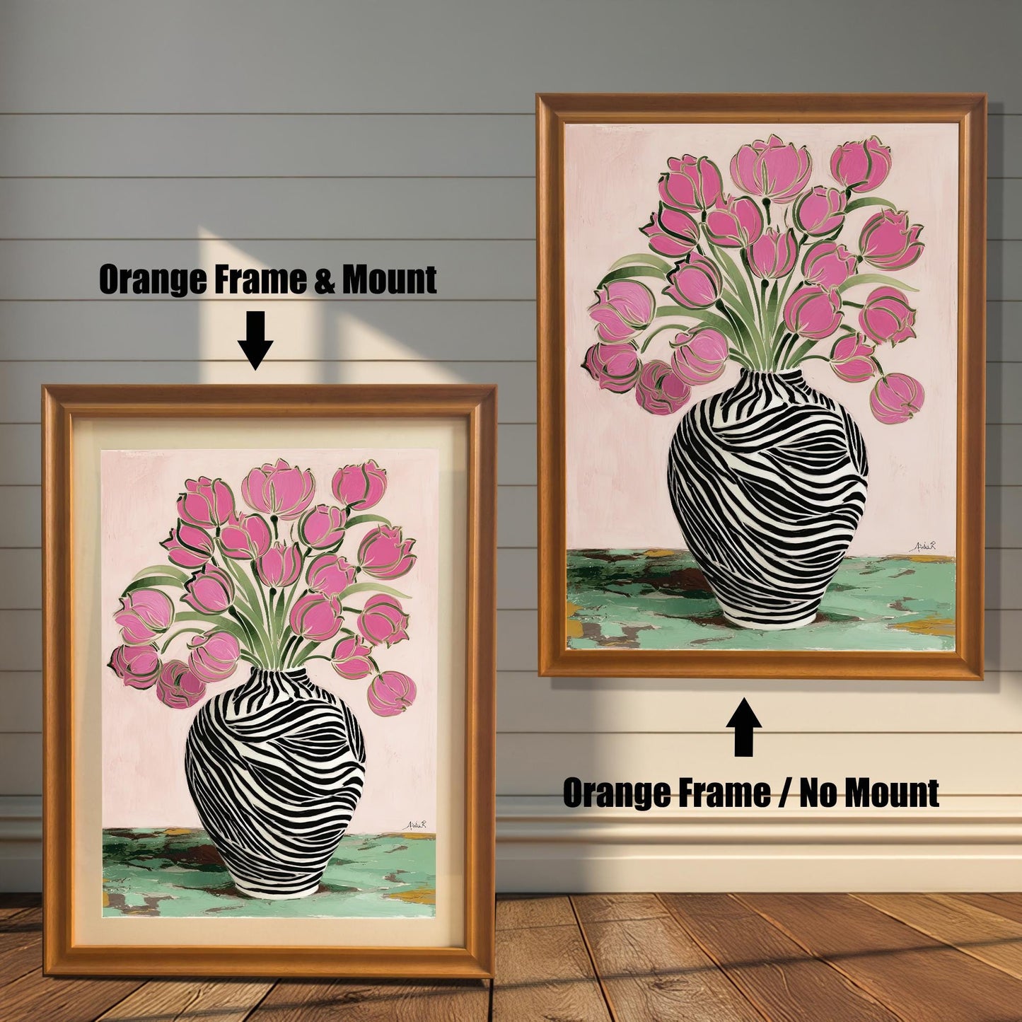 Zebra Vase and Pink Tulips art print shown in two orange wood frames on a rustic wood panel wall. The left frame includes a mount/mat, and the right frame shows the print without a mount/mat.