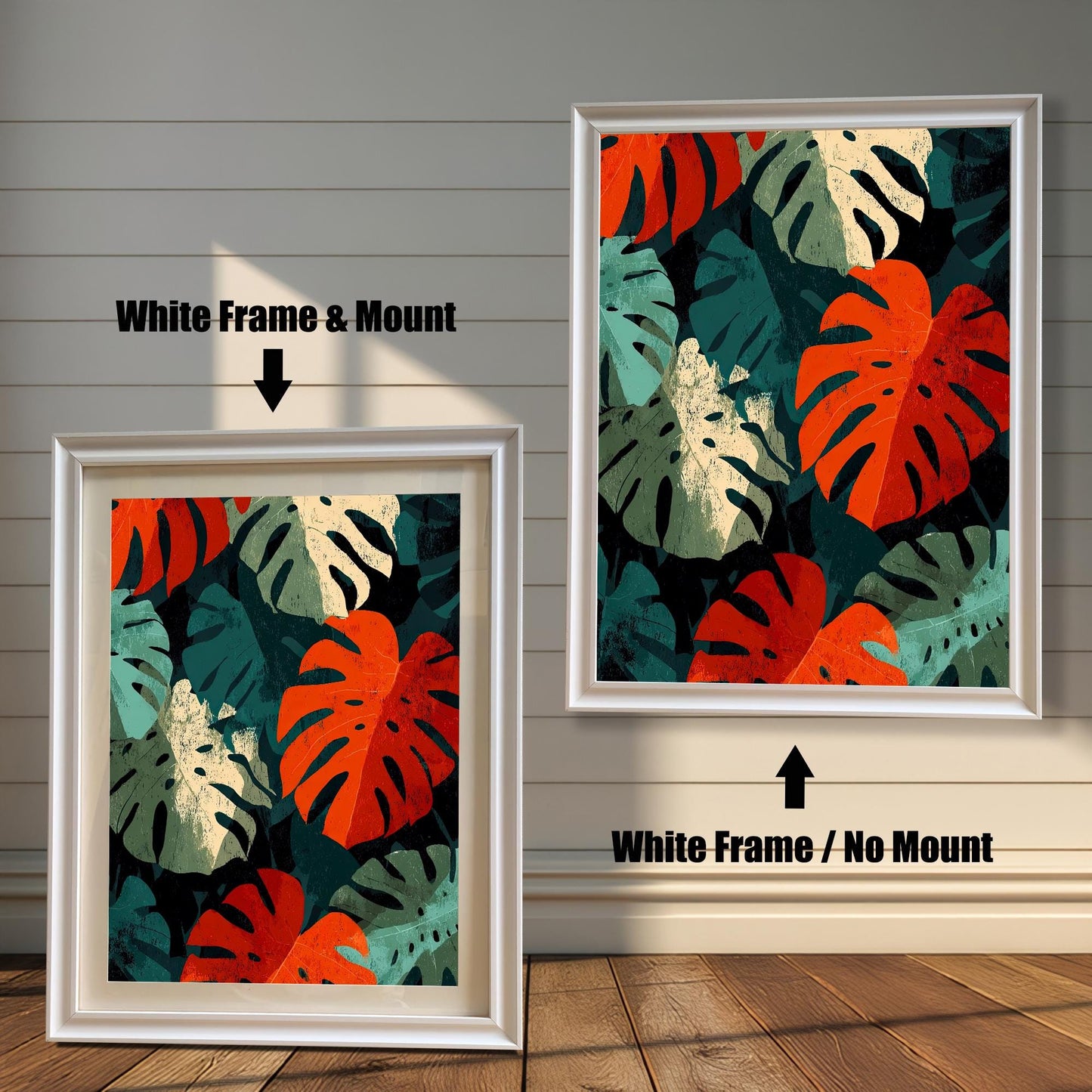 Close-up view of a framed art print featuring a repeating pattern of bold, stylized Monstera leaves in deep red, teal, cream, and dark green. The image shows two frame options: a White wood frame with a mount (matting) and a White wood frame with no mount around the print.
