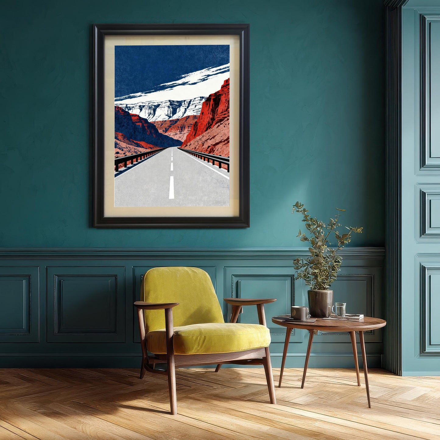 A framed art print with a black frame and a visible mount (matting), hanging on a bold, dark teal or green wall. Below the print are a mid-century modern chartreuse yellow armchair and a small wooden side table with a plant.