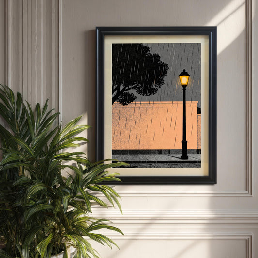 The black wood-framed art print with a white mount hanging on a sophisticated beige wall with classic molding, partially framed by a large green indoor plant.