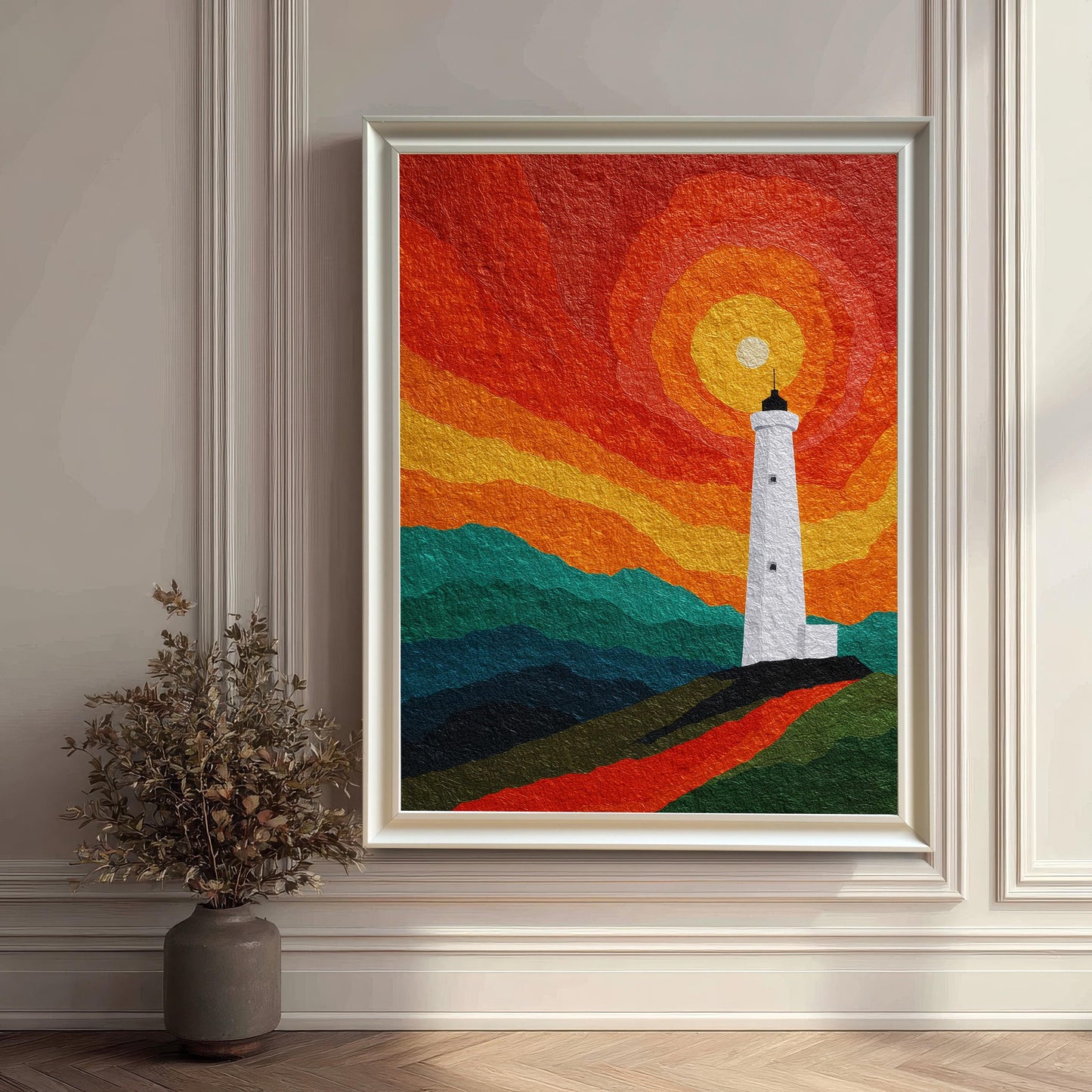 A large-scale lighthouse art print in a sleek white wood frame, leaning against an elegant white paneled wall on a dark herringbone floor beside a decorative dried floral arrangement.
