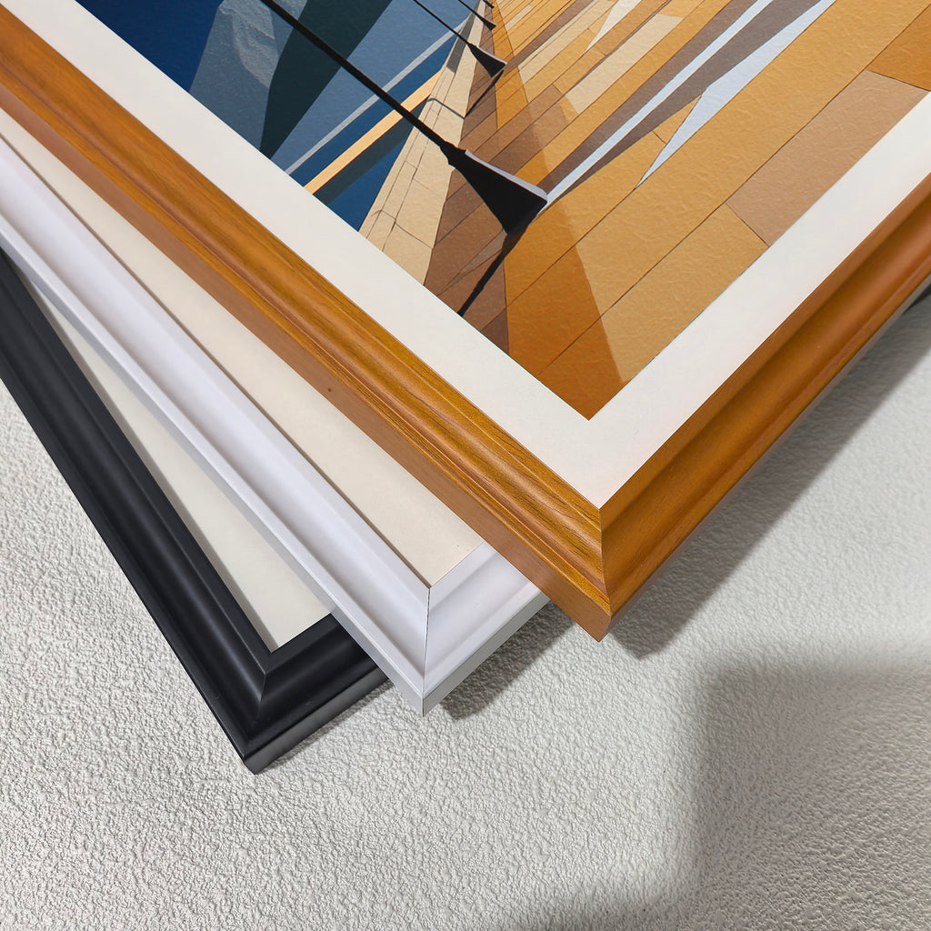 Close-up corner detail of the geometric pier and mountain artwork showing three stacked frame options: natural wood, white, orange, and black.