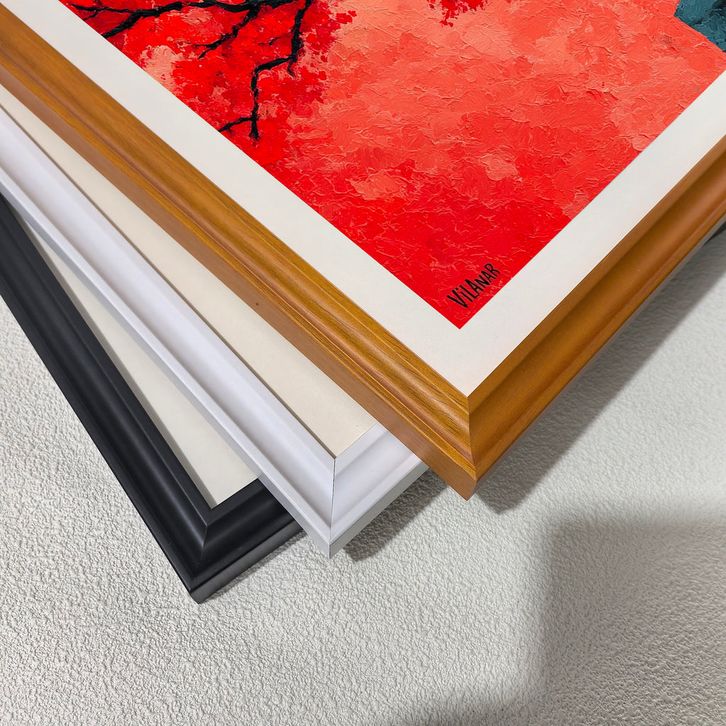 A close-up, stacked view of the corners of three different wooden picture frames: black, white,  and light brown (wood grain), placed over a highly textured section of the red tree painting.