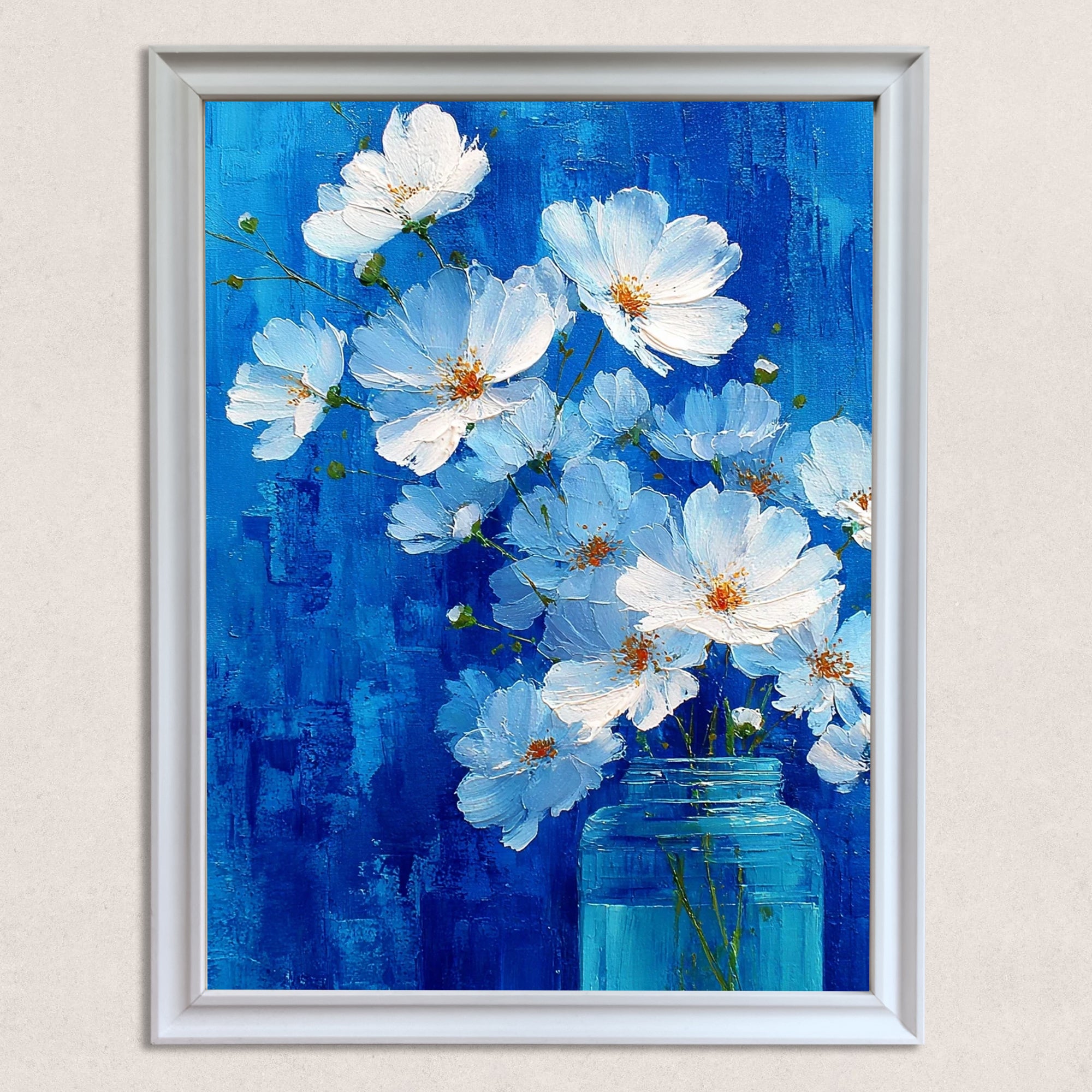 A vertical, white-framed painting of white cosmos flowers with orange centers in a light blue glass jar, set against a highly textured, vibrant cobalt blue background.