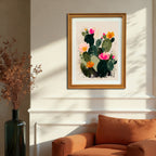 The abstract cactus art print, in a gold/natural wood frame, hangs on a wainscoted cream wall above an orange armchair in a sunlit room, displaying a southwestern or desert modern style.