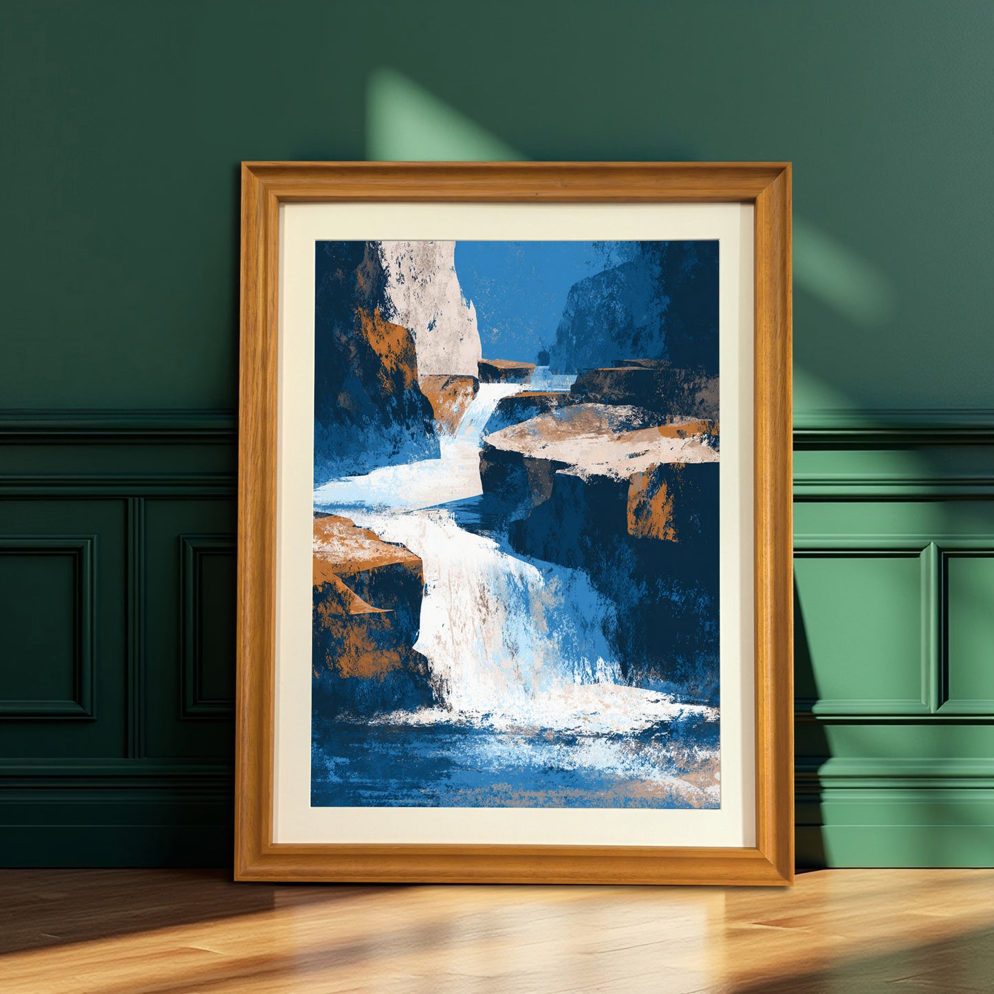 Vertical abstract waterfall art print with blue, white, and orange colors in a natural light brown wood frame, resting on a wooden floor against a dark green paneled wall.