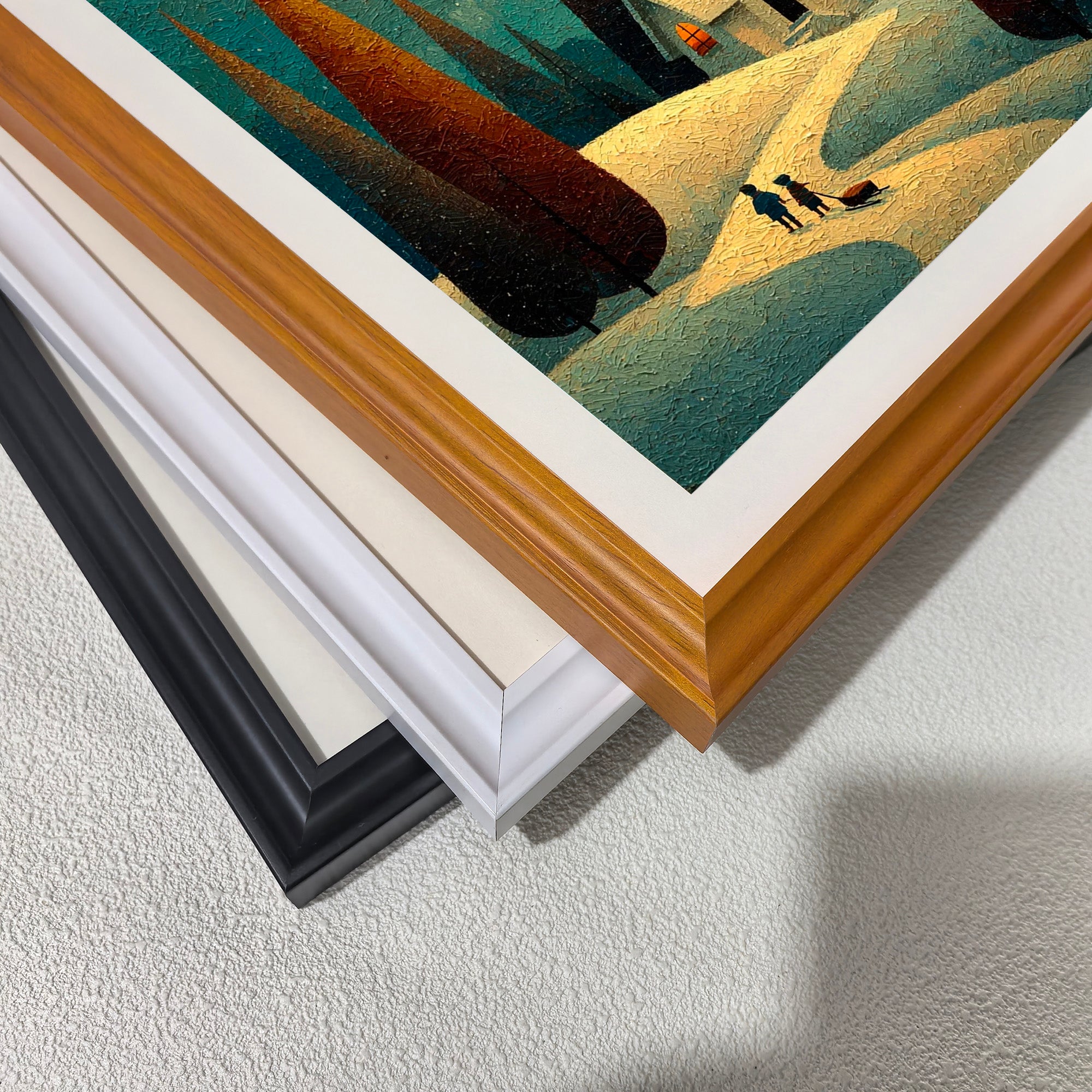 Close-up corner detail of the whimsical winter scene artwork showing three stacked frame options: , white, orange, and black.