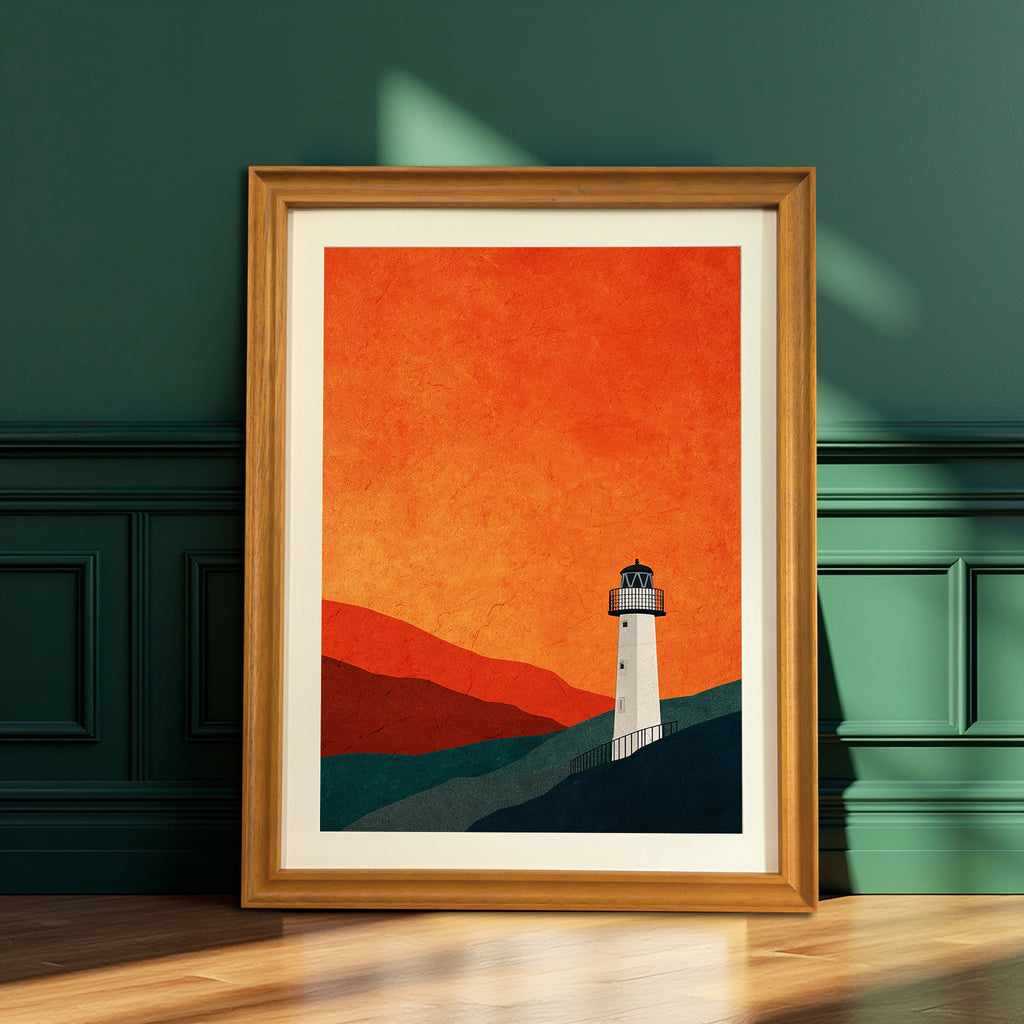 Minimalist lighthouse print with an orange and blue-green color palette, framed in natural wood with a mat, leaning on a wooden floor against a dark green paneled wall.