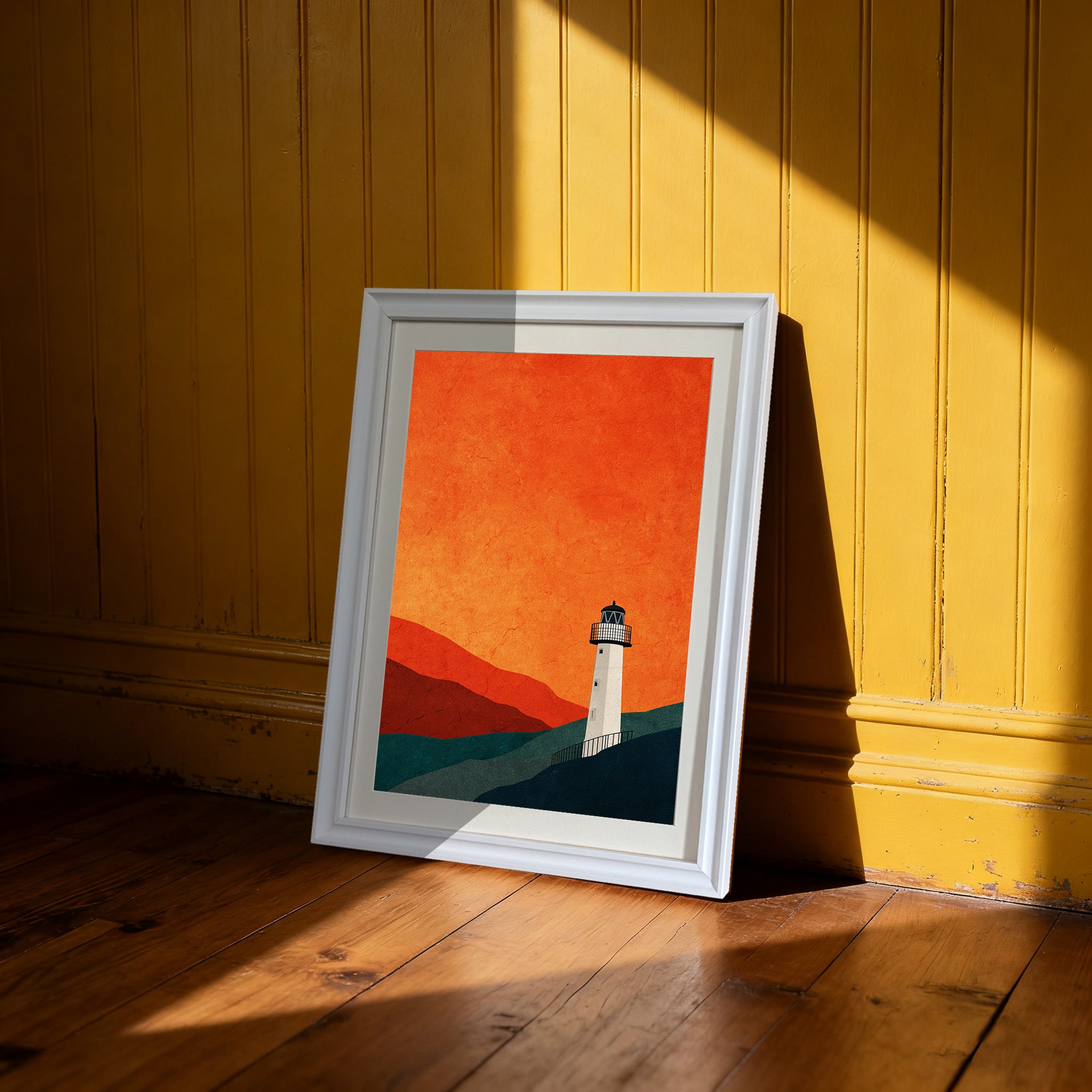 Minimalist lighthouse print in a white frame, leaning on a wooden floor against a bright yellow beadboard wall, in dramatic sunlight.