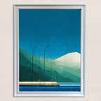 Geometric art print of a mountain and water landscape with a pier and streetlights, framed in white, hanging on a light textured wall