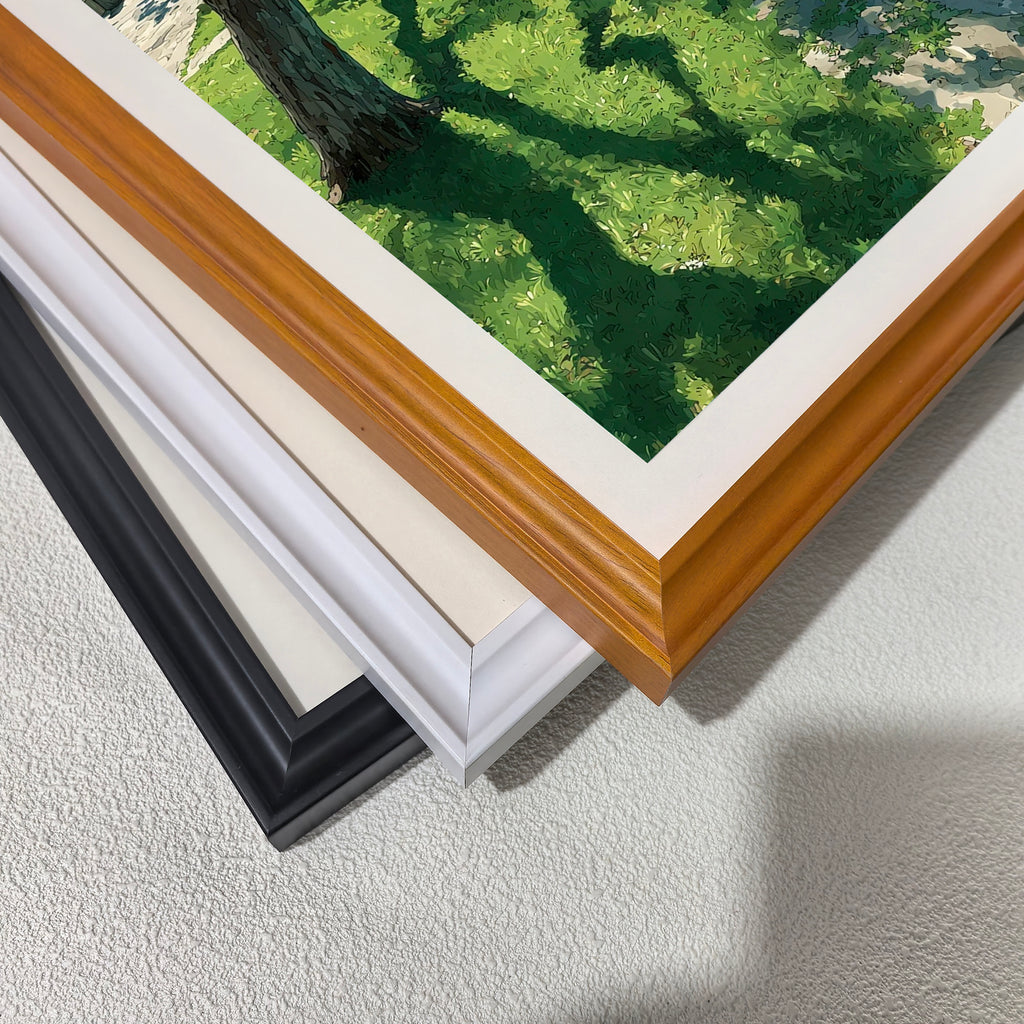 A stack of four frame corners: black, off-white, white, and a light wood grain (brown). This displays the different framing options available for the art print.