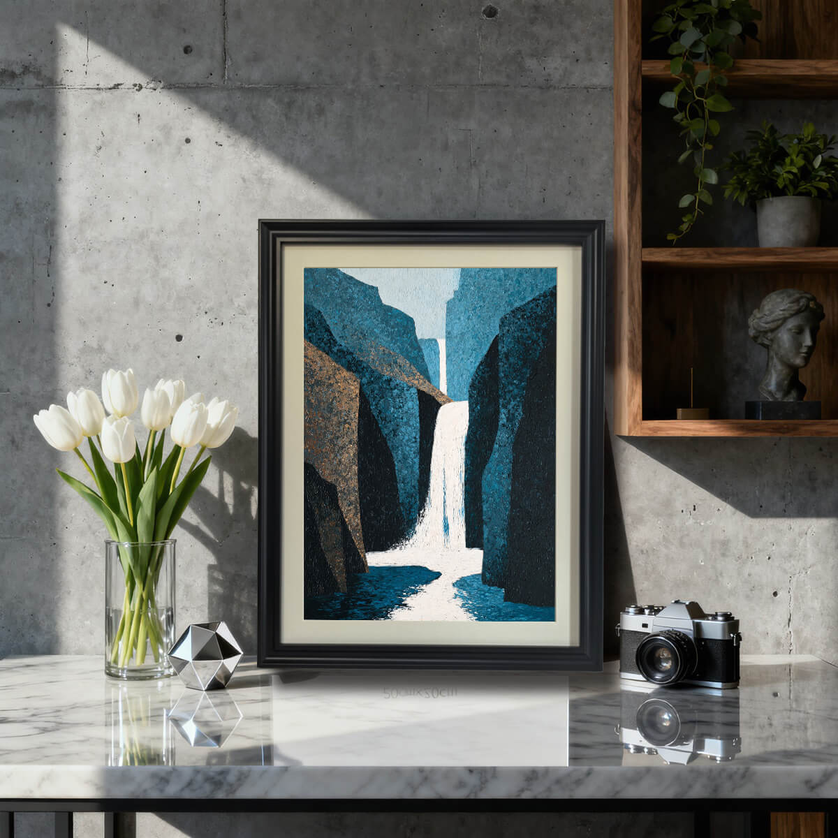 Abstract waterfall art print in a black wood frame with a mat, sitting on a marble countertop next to a vase of white tulips and a vintage camera, ideal for modern or industrial decor.