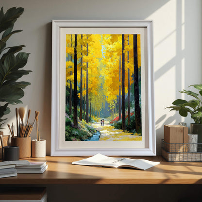 The golden forest painting in a white frame, sitting on a wooden desk alongside paintbrushes, notebooks, and small indoor plants.