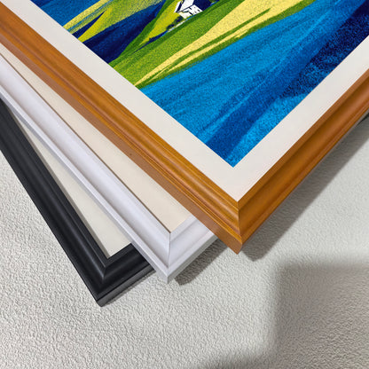 Close-up corner detail of the art print showing three stacked frame options: , white, orange, and black.