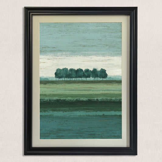 Vertical abstract landscape art print featuring a row of trees and layered shades of green and teal, framed in a classic black wood frame with a cream mat, hanging on a lightly textured beige wall.