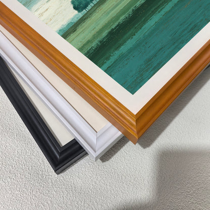 Close-up corner detail of the art print showing three stacked frame options: , white, orange, and black.