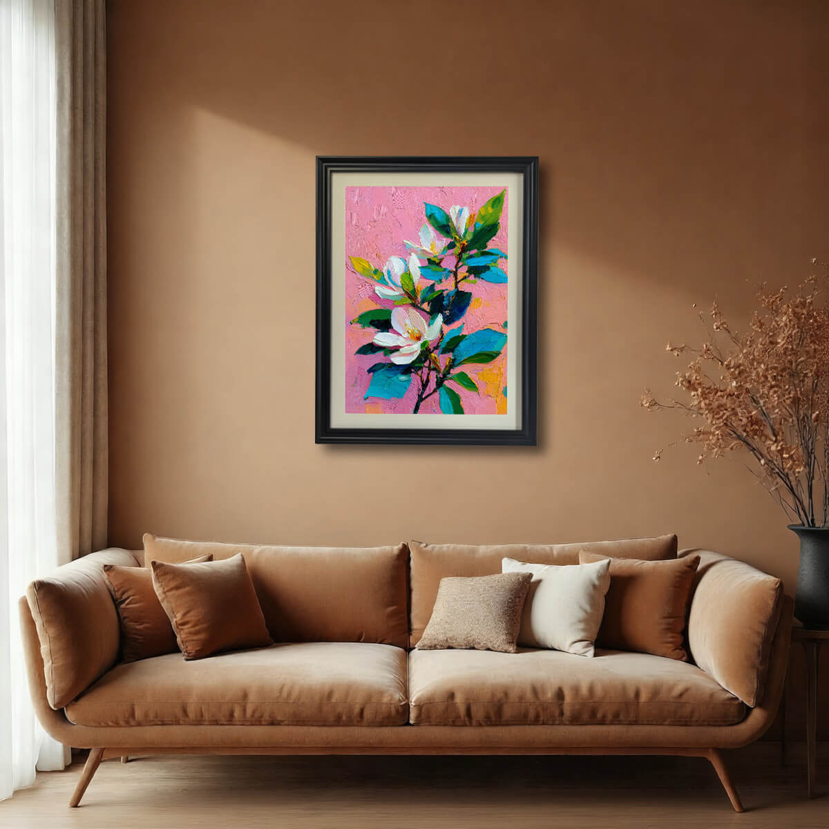 Large black-framed magnolia wall art hanging above a tan sofa in a contemporary living room.
