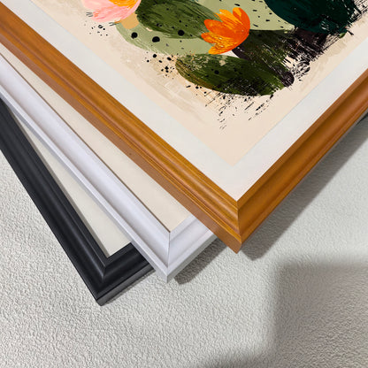 A close-up, stacked corner view of the art print, showing four available frame options: orange, cream/off-white, bright white, and black. The artwork is a detail of a cactus illustration.