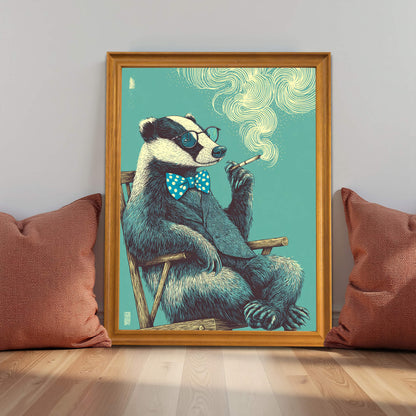 Framed badger wall art in a light wood frame resting on a hardwood floor between two mauve pillows, showcasing cozy living room decor.