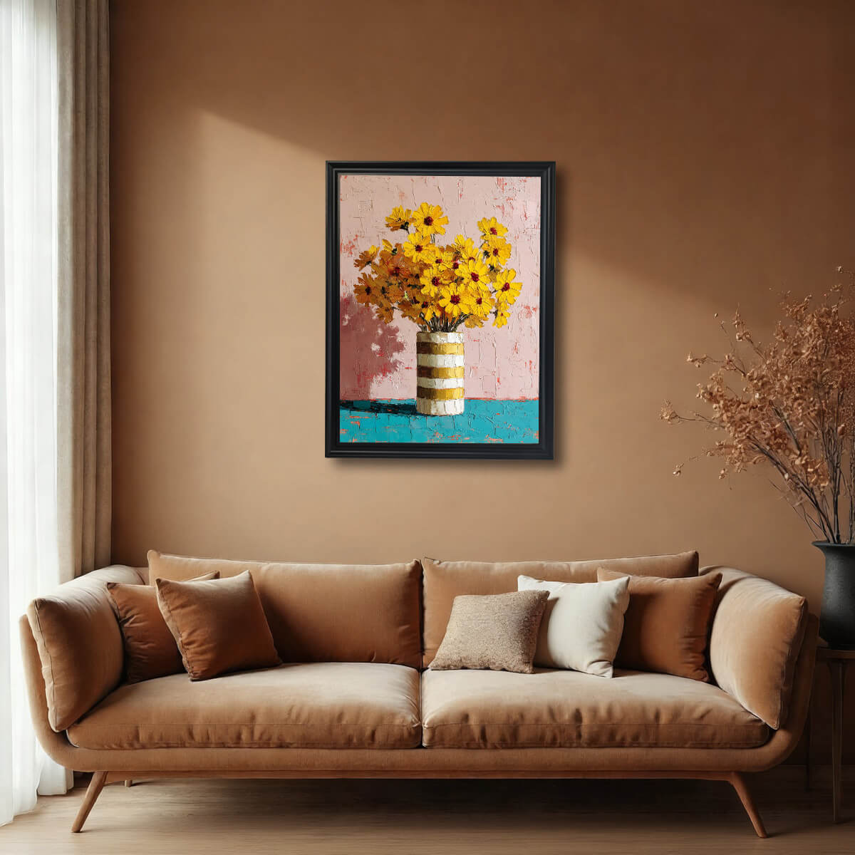Vertical yellow floral wall art in a black frame hanging above a modern tan velvet sofa in a minimalist living room.