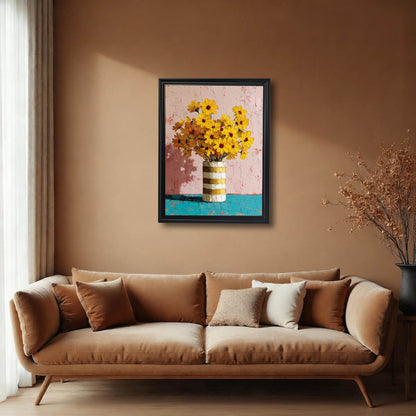 Vertical yellow floral wall art in a black frame hanging above a modern tan velvet sofa in a minimalist living room.