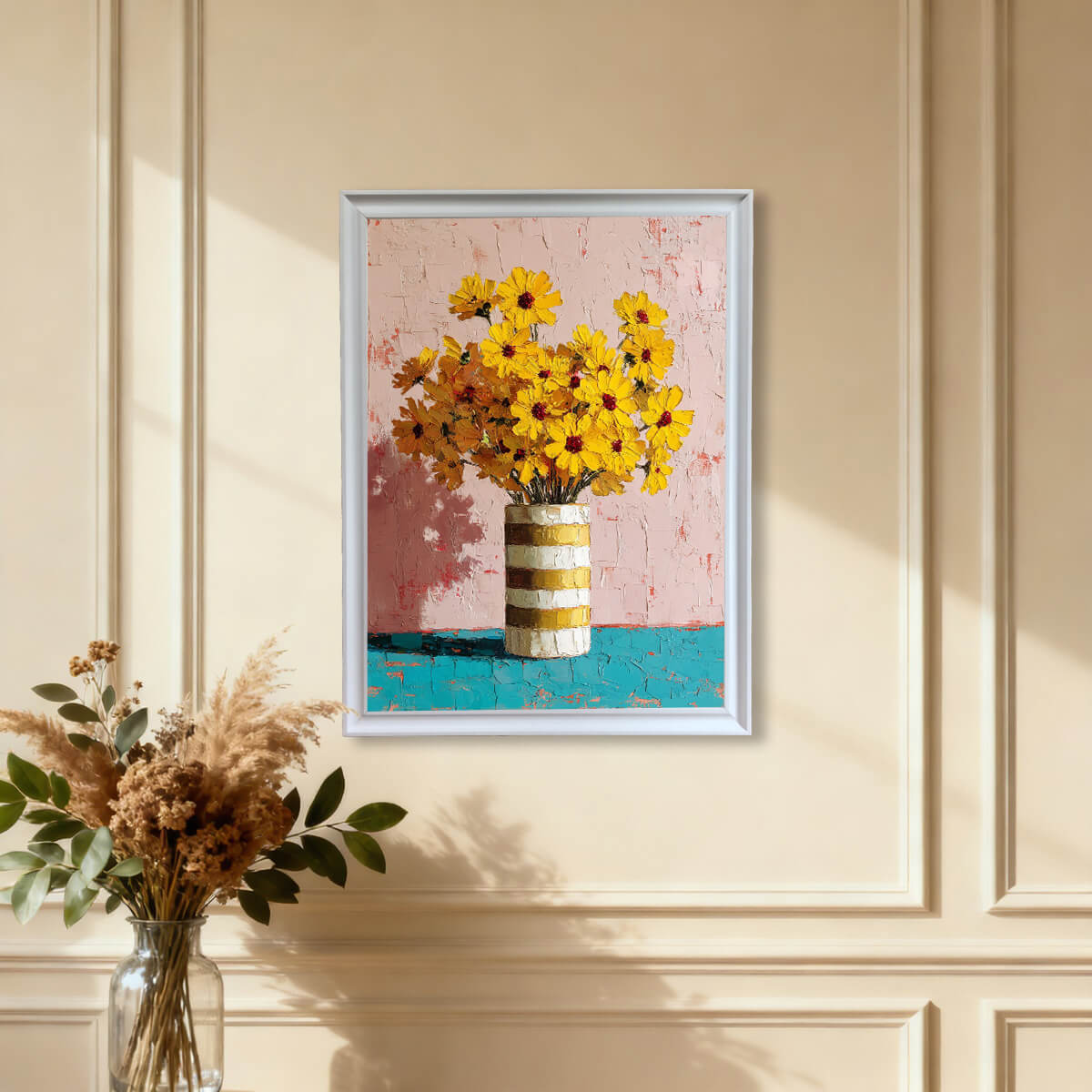 White framed palette knife painting of yellow daisies on a beige wall with classic architectural wall molding.