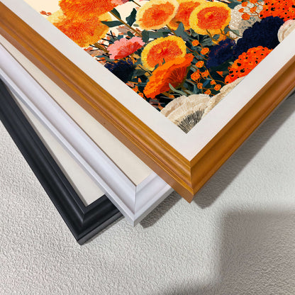 A close-up, angled shot of three stacked picture frames (black, white, and wood) showing the corner joins and the texture of the floral print inside.