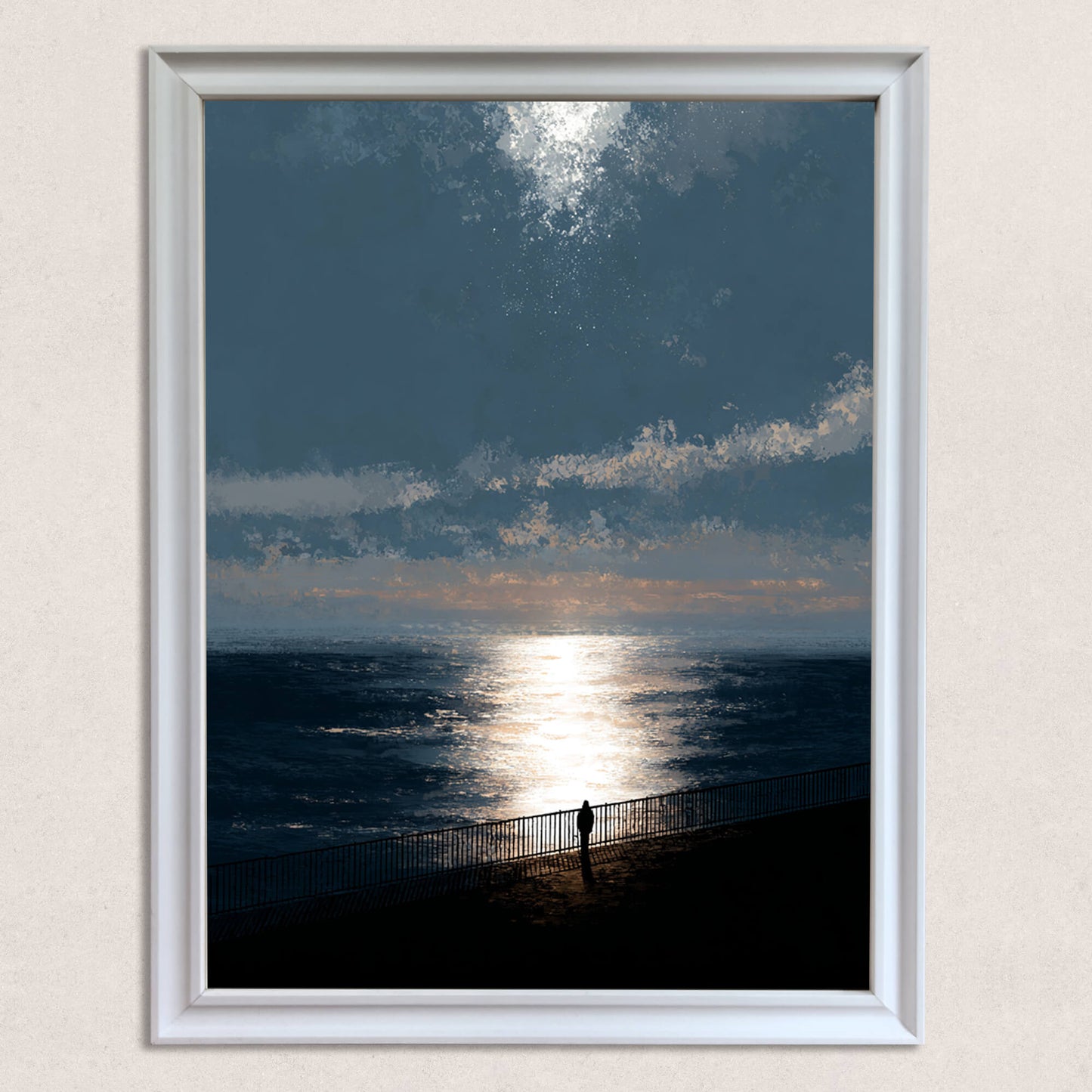 Close-up studio shot of the moody ocean sunset art print in a thick white wood frame. The print features a solitary figure on a promenade railing, with dramatic sun reflection on the dark blue water.