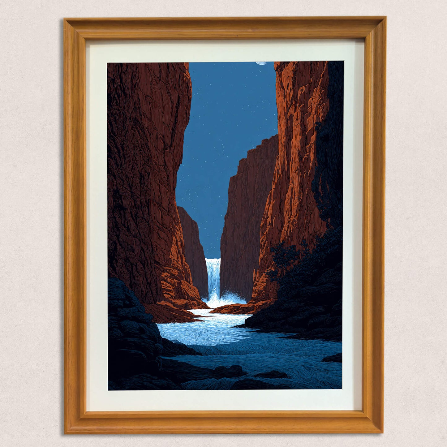 A straight-on view of the framed art print, illustrating the deep red tones of the canyon walls, the bright blue of the river, and the white of the cascading waterfall, displayed in a natural wood frame.