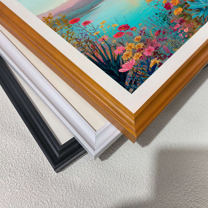 A close-up, top-down view of three picture frames (black, white, and wood-toned) stacked diagonally on a white textured surface, showcasing the different frame finishes.