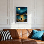 A white-framed art print centered above a brown leather sofa with striped and blue pillows. The white paneled wall provides a bright contrast to the dark, mystical nighttime landscape of the artwork.