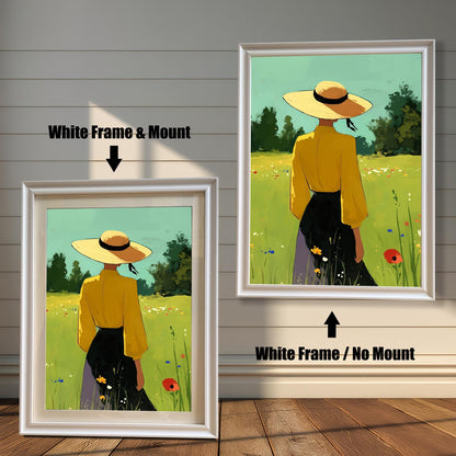 A split-view image showing two framed art prints against a white wood-paneled wall. The left print has a white frame and a white mount, with a black arrow pointing to it and text that says "White Frame & Mount." The right print has the same white frame but no mount, with a black arrow pointing up to it and text that says "White Frame / No Mount." Both prints show the same image of a person in a yellow shirt and straw hat standing in a grassy field.