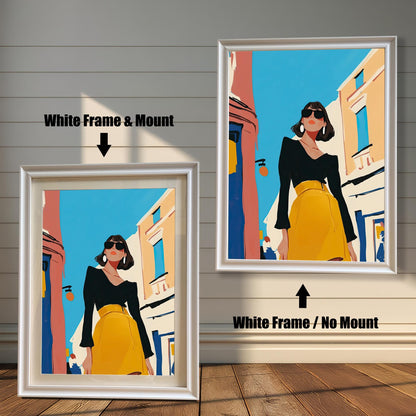 A split image showing two different framing options for the same artwork. On the left, a framed print with a white frame and a white mat (mount) is labeled "White Frame & Mount." On the right, the same print is shown in a white frame without a mat, labeled "White Frame / No Mount." Both images are against a rustic wood-paneled wall. The art depicts a stylish woman in a black shirt and yellow skirt standing on a street.
