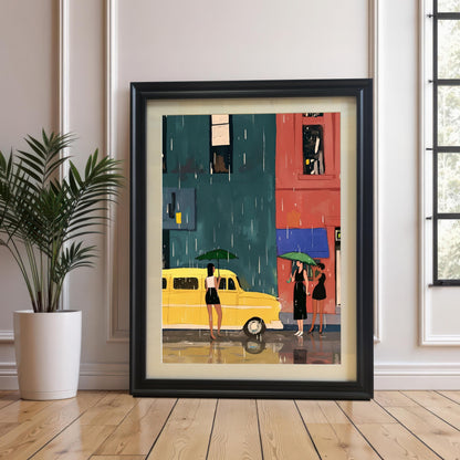 A framed art print with a black frame and a white mat leans against a white paneled wall and rests on a light-colored wooden floor. The art depicts a street scene with a yellow bus and three women with umbrellas in the rain. A potted plant sits on the floor to the left of the frame.