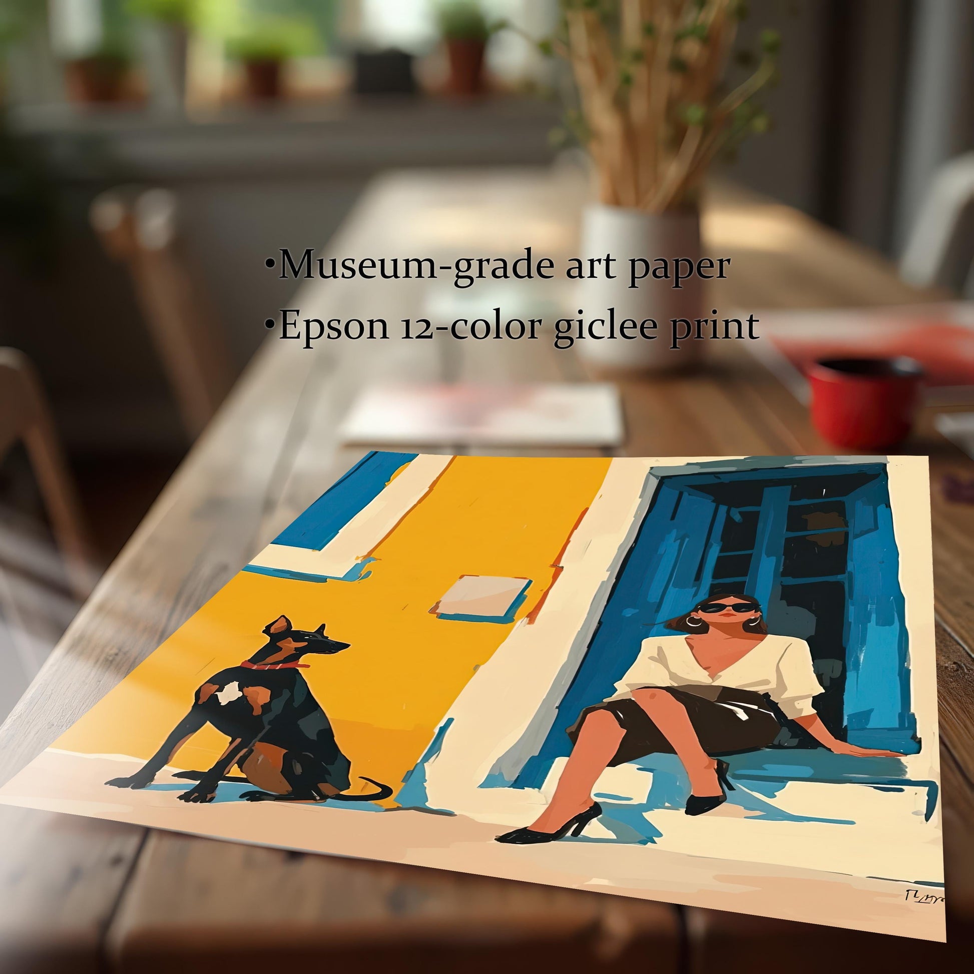 A close-up shot of an unframed art print lying on a rustic wooden table. The art depicts a woman in a white shirt and black skirt sitting on a step next to a Doberman dog. Text on the image highlights the quality of the print: "Museum-grade art paper" and "Epson 12-color giclee print."