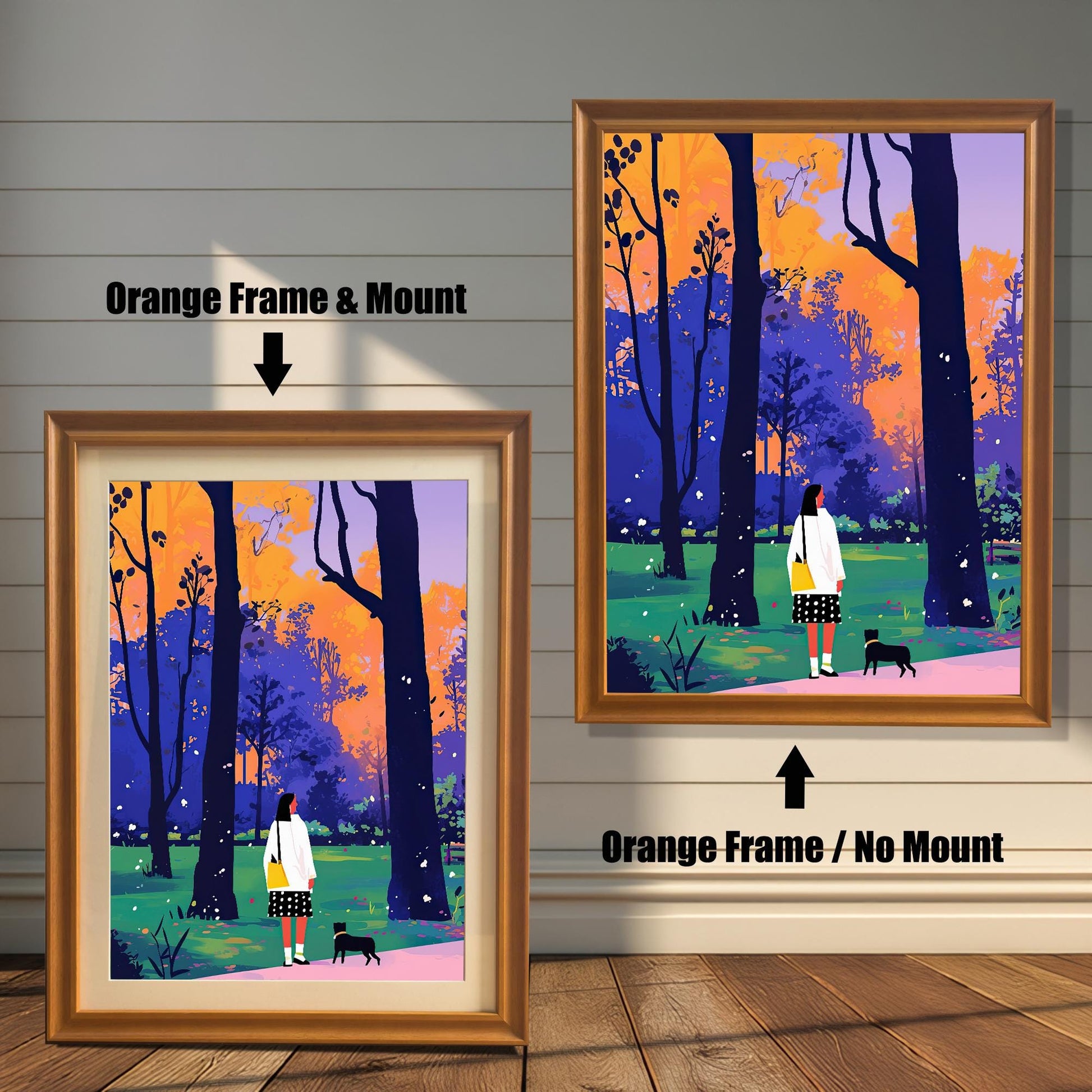A split image showing two different framing options for the same artwork. On the left, a framed print with an orange wood-tone frame and a white mat (mount) is labeled "Orange Frame & Mount." On the right, the same print is shown in an orange wood-tone frame without a mat, labeled "Orange Frame / No Mount." Both images are against a rustic wood-paneled wall. The art depicts a woman and a small black dog walking through a park with colorful trees.