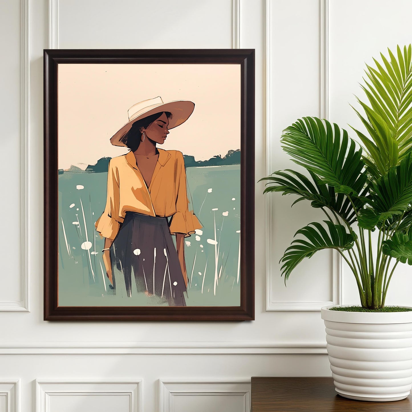 Coffee wood framed wall art print of a woman with a sun hat in a field, hanging on a white wall next to a potted plant. A sophisticated and calming art piece for a living room or bedroom.