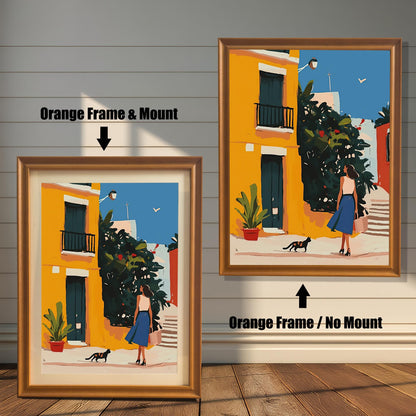 Orange wood framed wall art print of a woman and a cat in a sunny European alley, shown with and without a matboard mount. Colorful and vibrant art for travel lovers.