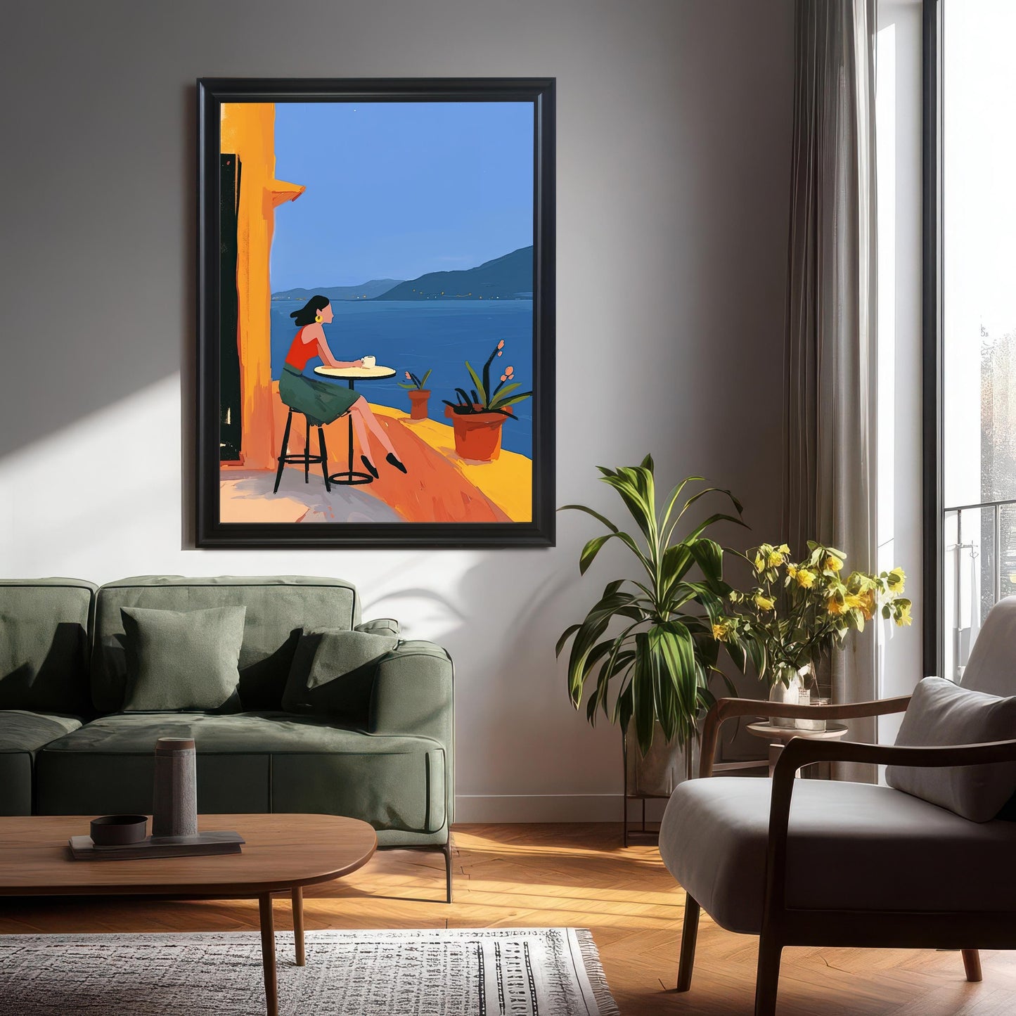 Modern living room with a large, black-framed wall art print of a woman on a balcony with a sea view. The print is a focal point above a green sofa.