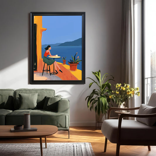 Modern living room with a large, black-framed wall art print of a woman on a balcony with a sea view. The print is a focal point above a green sofa.