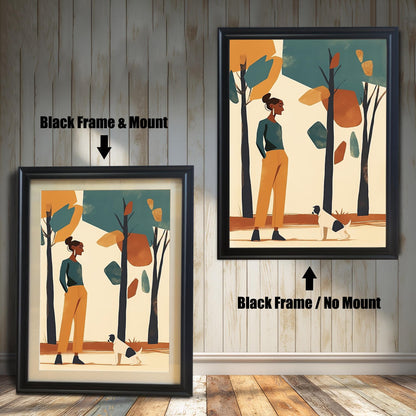 Two framed art prints of a woman and a dog in a park. The left print has a black frame and a white mat ("mount"), while the right print has a black frame with no mat.