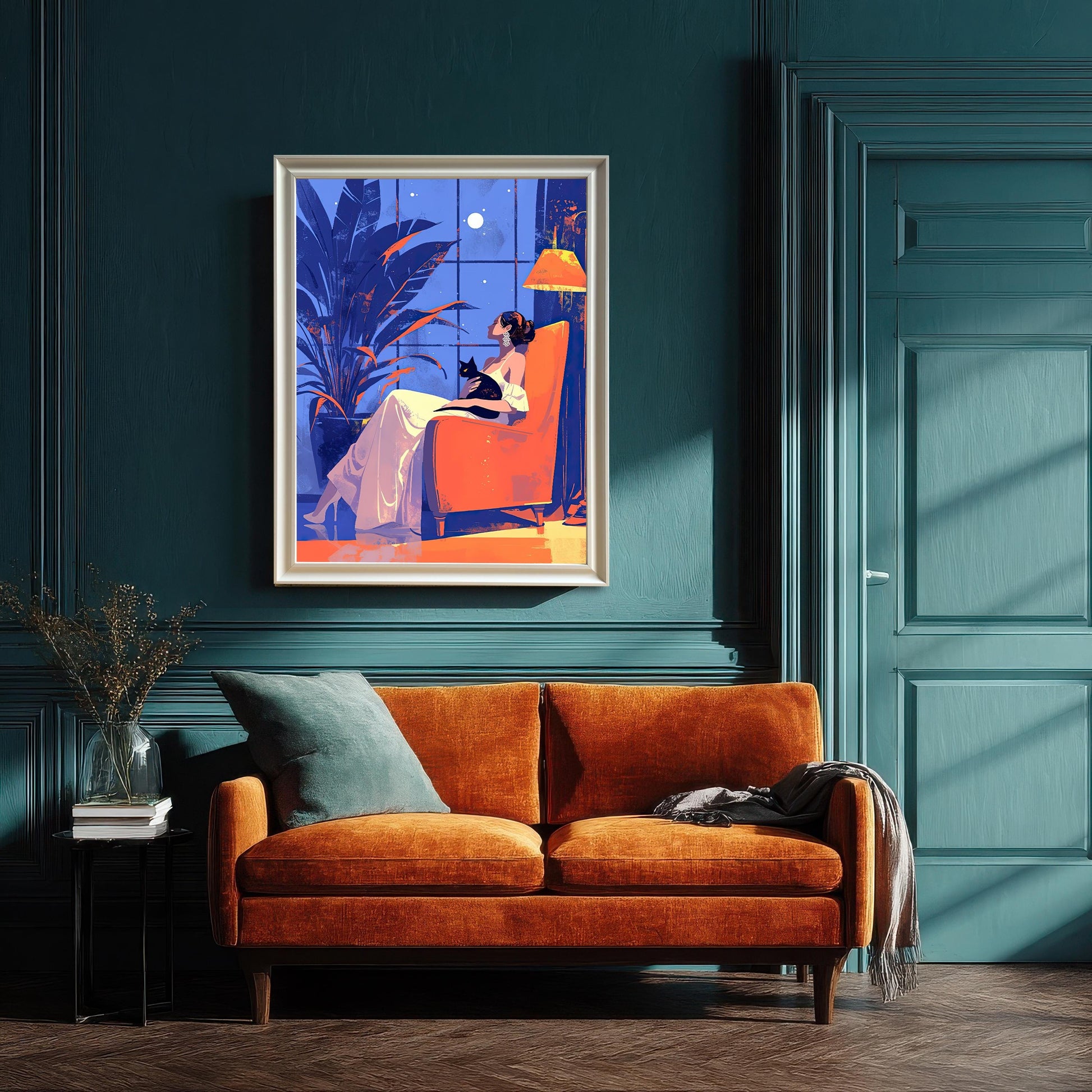 A framed art print of a woman and a cat sitting in an orange chair, hanging on a dark teal wall above a matching orange sofa.