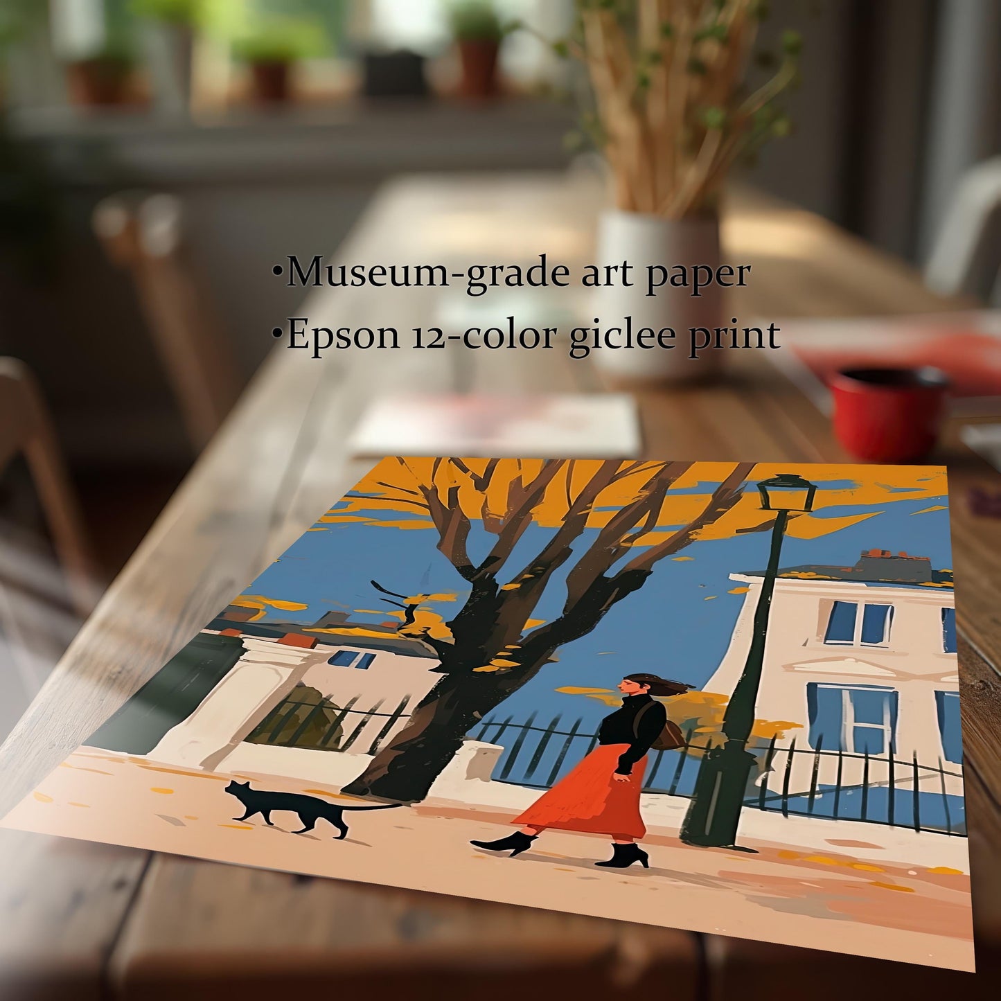 A close-up, angled view of a giclee print on museum-grade art paper, depicting a person walking a black cat on a street lined with autumn trees and a lamppost.
